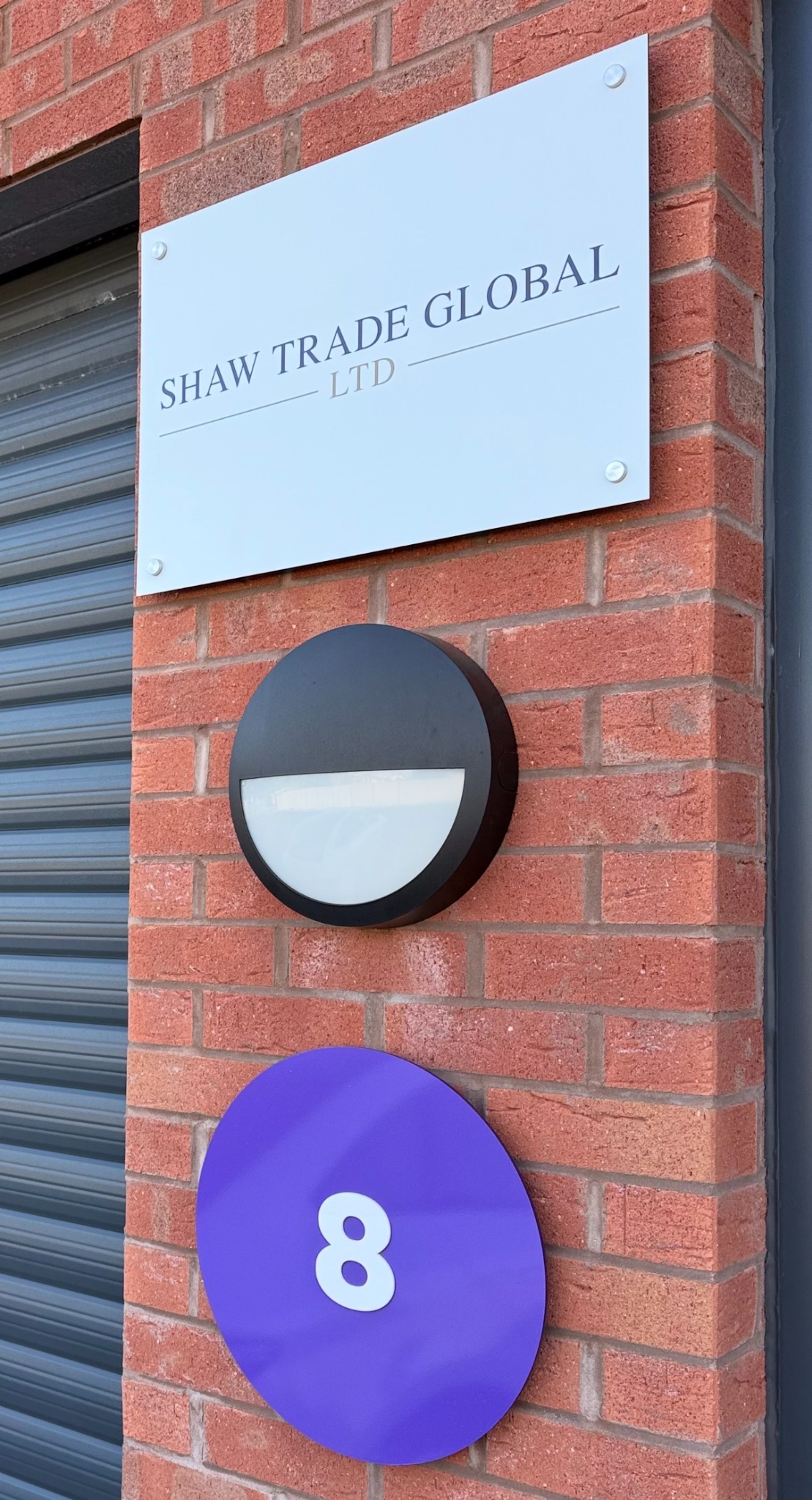 Shaw Trade Global Ltd sign outside Unit 8